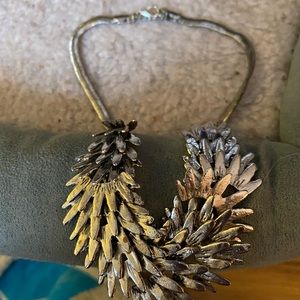 Daenerys Targaryen dragon scale necklace.